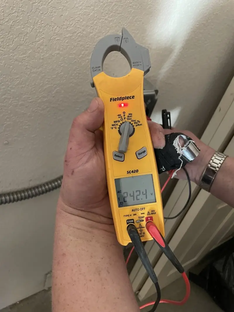 Voltage testing with clamp meter during Outlet Installation in Hempstead